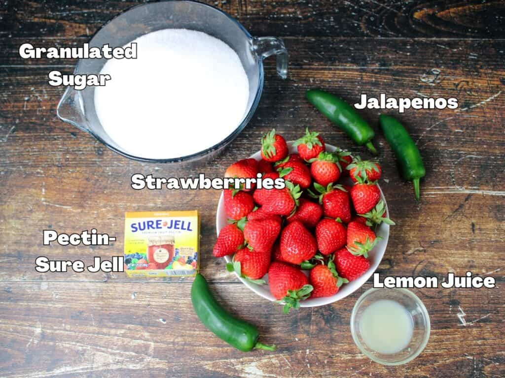 The ingredients for strawberry jalapeno jam -strawberries , sure jell , lemon juice , jalapenos and sugar 