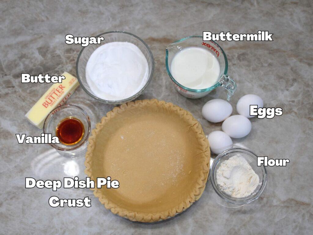 Ingredient photo:Ingredients for Southern Buttermilk Pie including buttermilk, eggs, sugar, butter, flour and pie crust